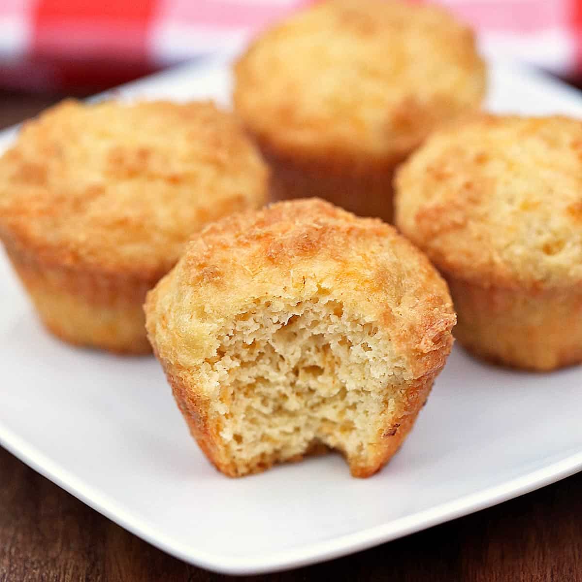 Keto cheese muffins are served on a white plate.