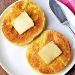 Keto English muffin is topped with butter.