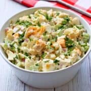 Cauliflower potato salad is served in a white bowl.