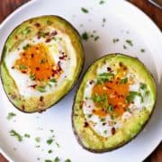 Avocado egg bake is served on a white plate.