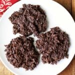 Coconut haystacks are served on a white plate.