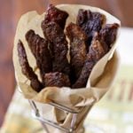 Keto beef jerky is served in a parchment-lined cone.