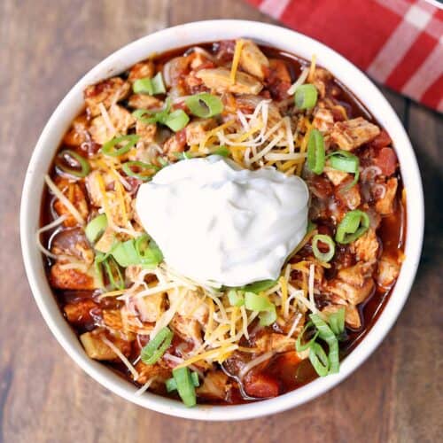 Leftover turkey chili is topped with a dollop of sour cream.