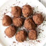 Keto truffles are served on a white plate.