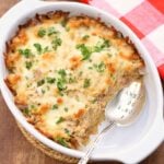 Keto tuna casserole is served with a silver spoon.