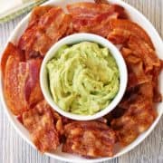 Bacon chips are served with guacamole for dipping.