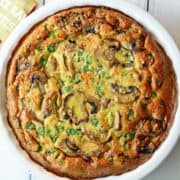 Mushroom frittata is served in a white baking dish.