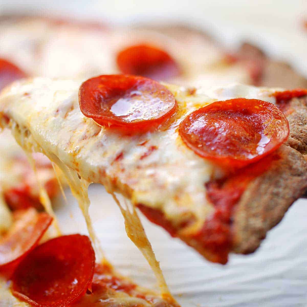 Almond flour pizza crust, topped with sauce, cheese, and pepperoni.
