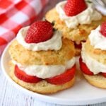 Keto strawberry shortcake is served on a white plate.