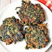 Spinach fritters are served on a white plate.