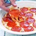 Scooping out pizza dip.