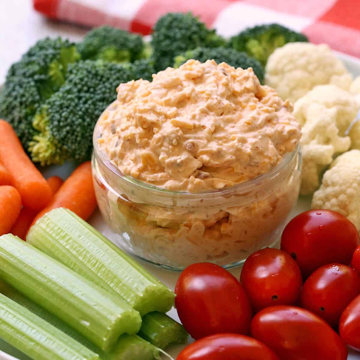 Cream cheese dip is served with fresh-cut veggies.