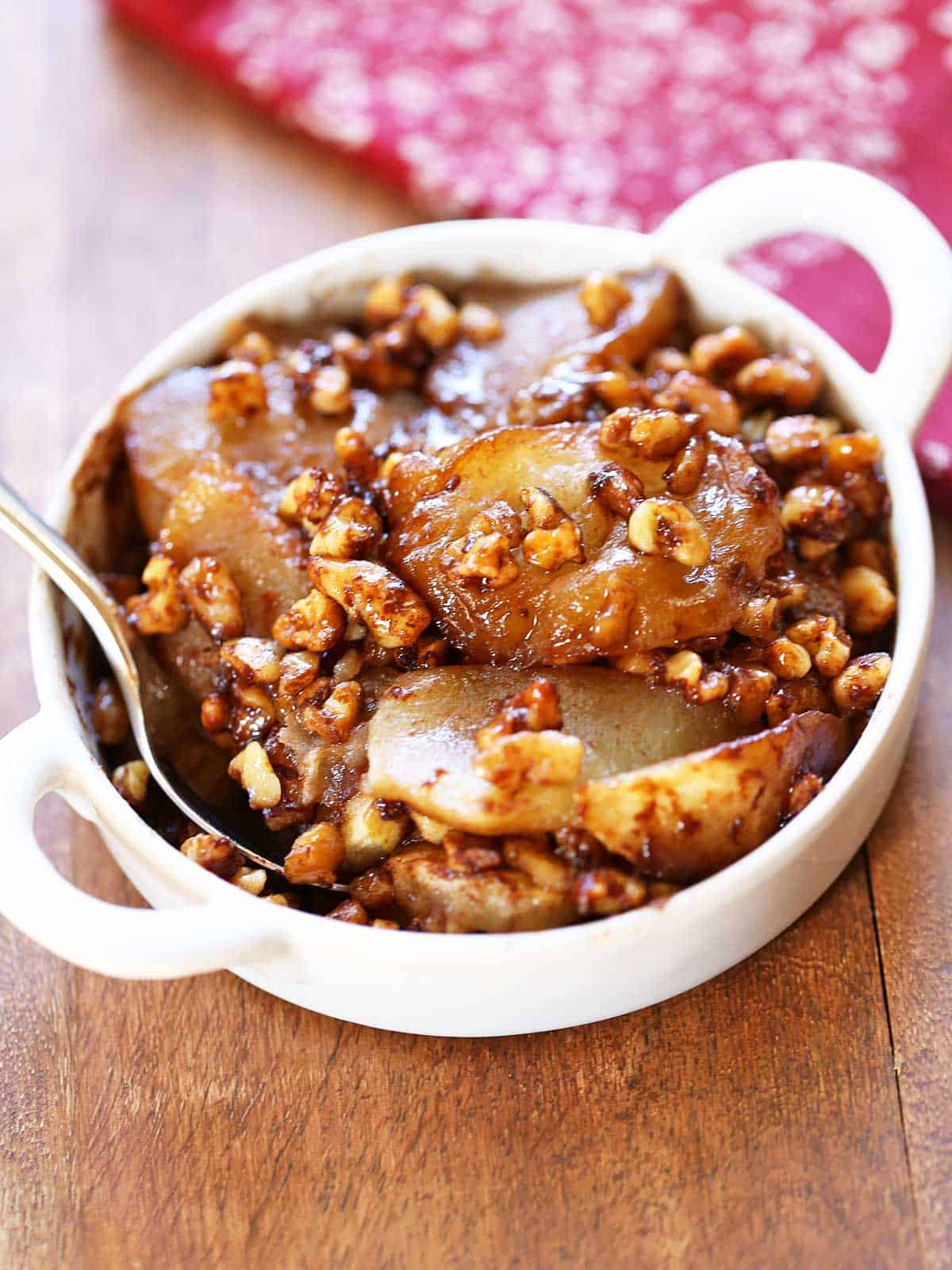 Keto apple crisp served in a white baking dish. 