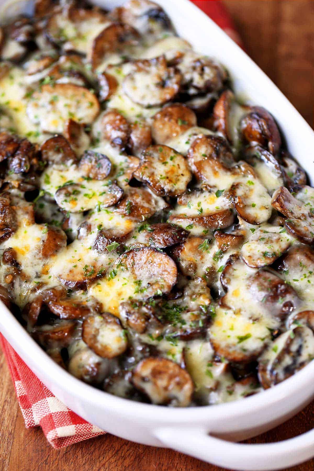 Mushroom casserole is served in a white baking dish. 