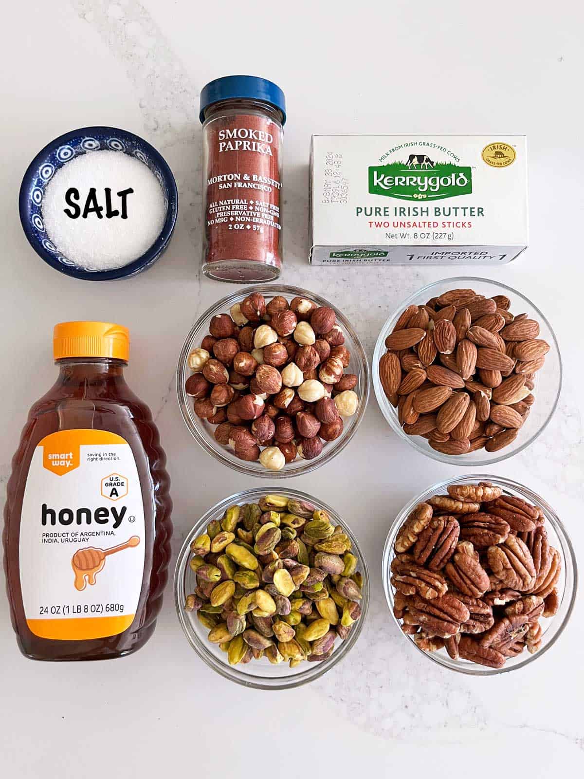 The ingredients needed to make honey-roasted nuts.