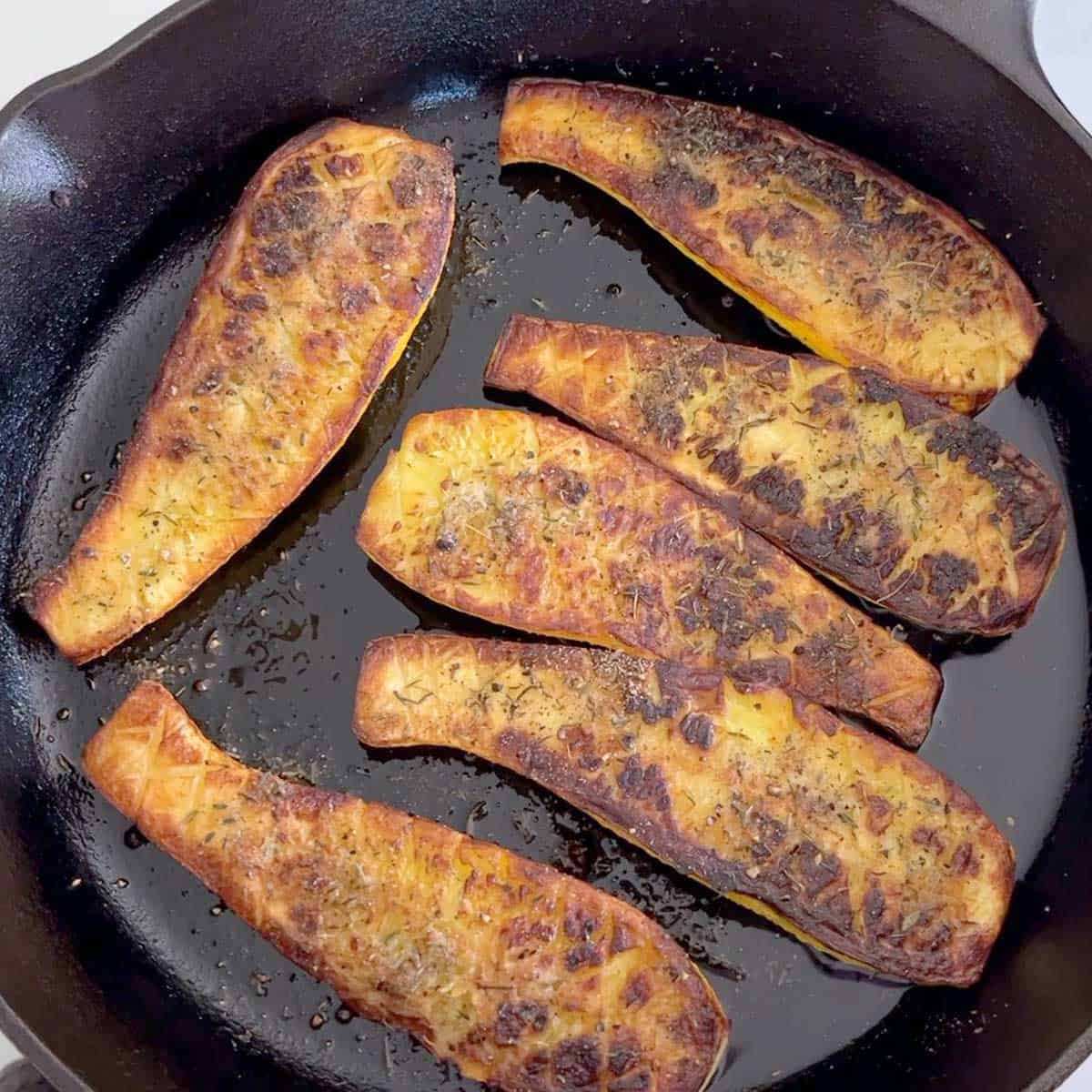 Roasted yellow squash is ready in the skillet.