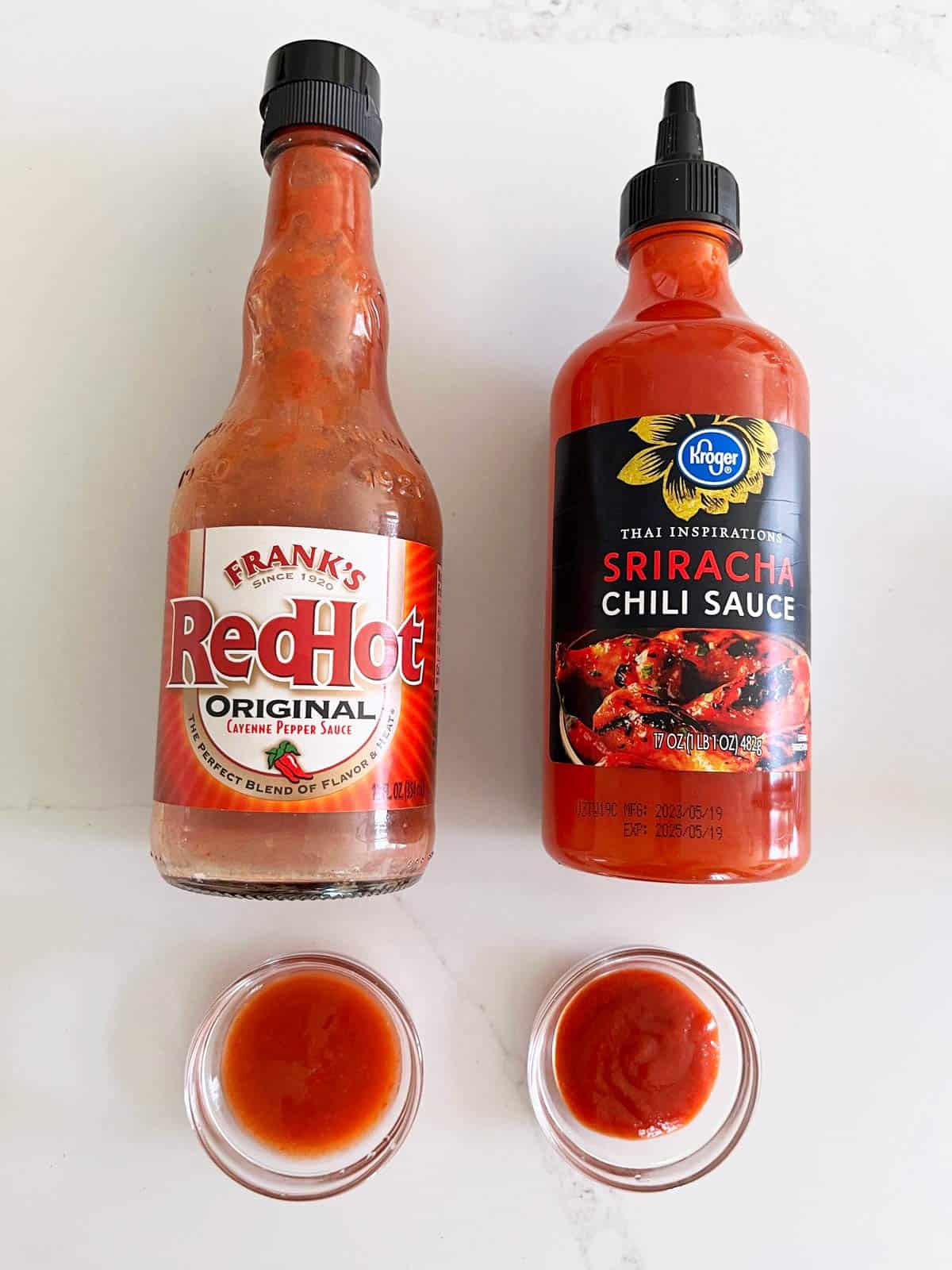 A comparison of sriracha and Frank's RedHot sauce.