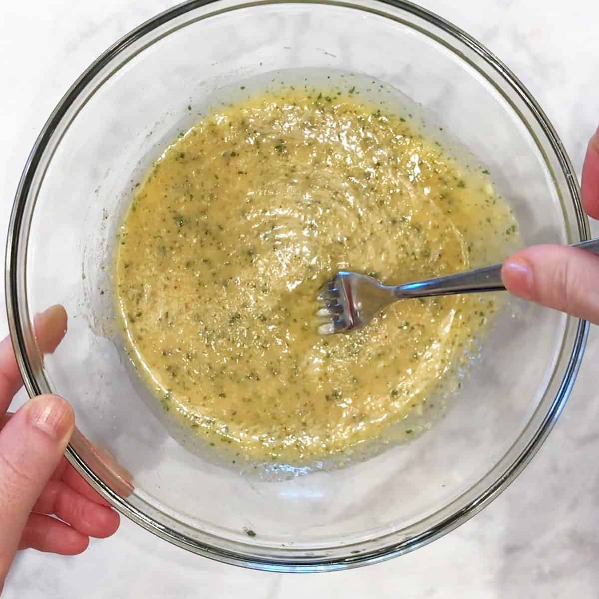 Preparing the butter mixture for the scallops.
