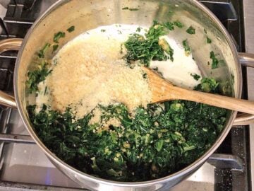 Adding the spinach, spices, heavy cream, and parmesan.