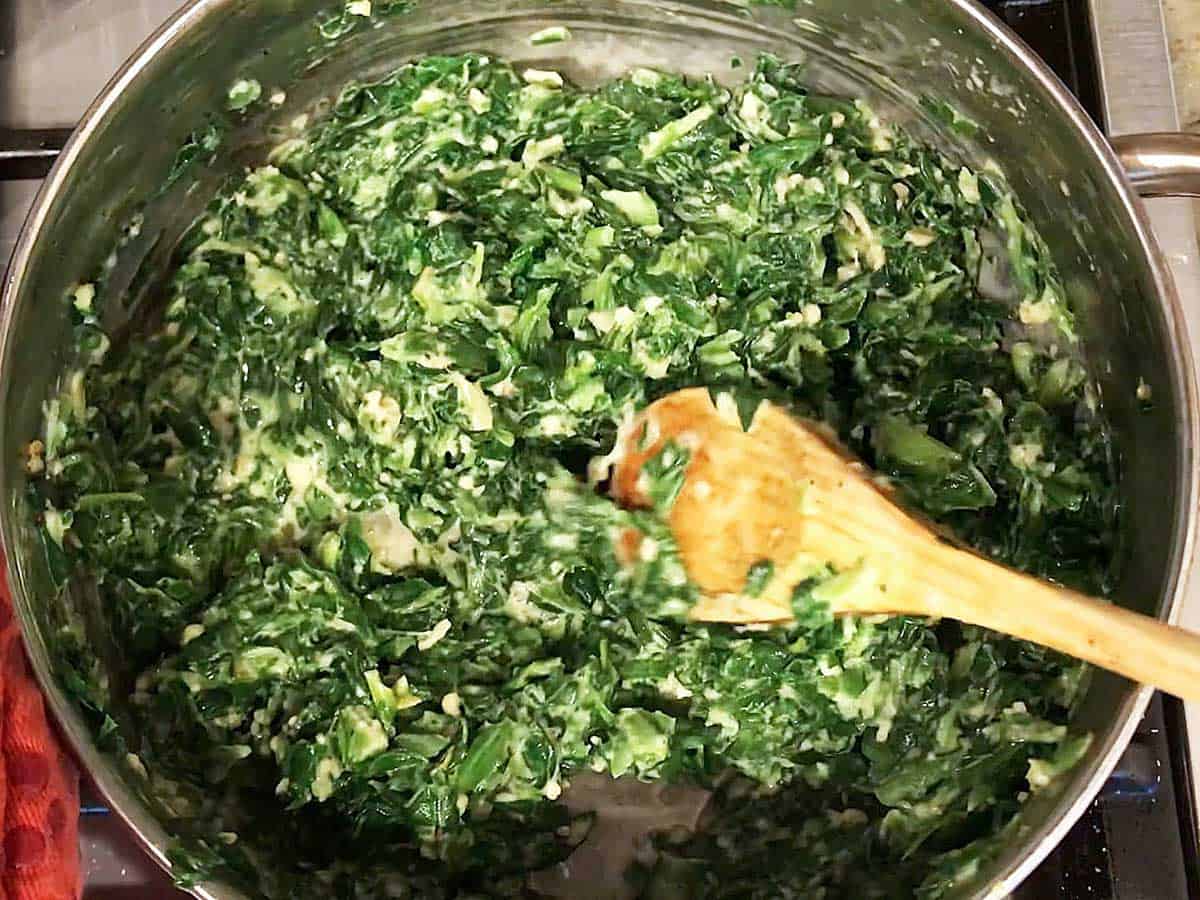 The creamed spinach is ready in the saucepan.