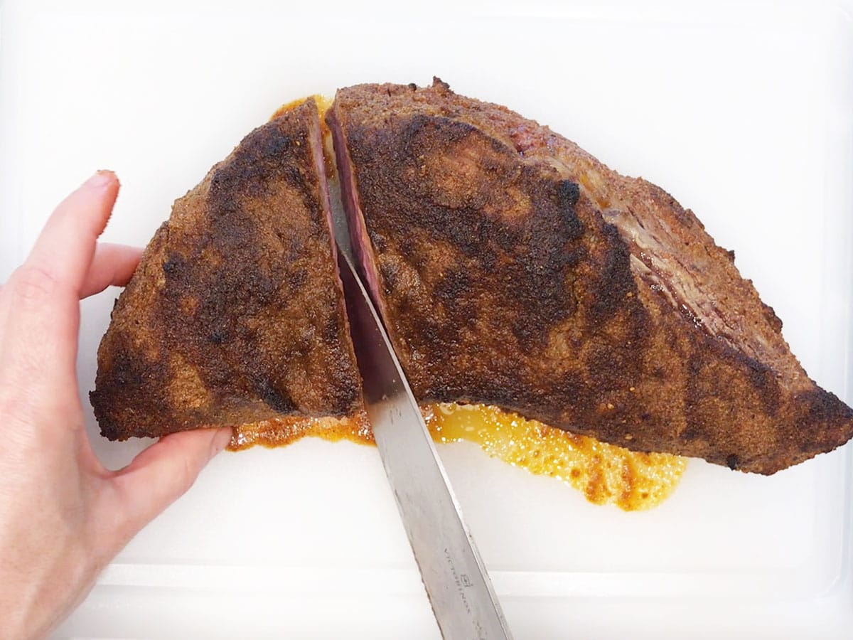 Cutting the tri-tip in half.