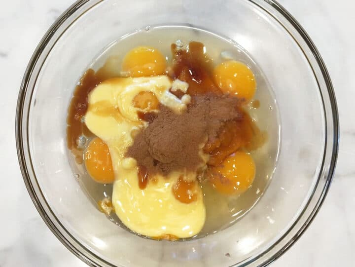 Pumpkin cupcakes wet ingredients in a bowl.