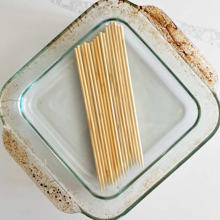 Soaking bamboo skewers in water.