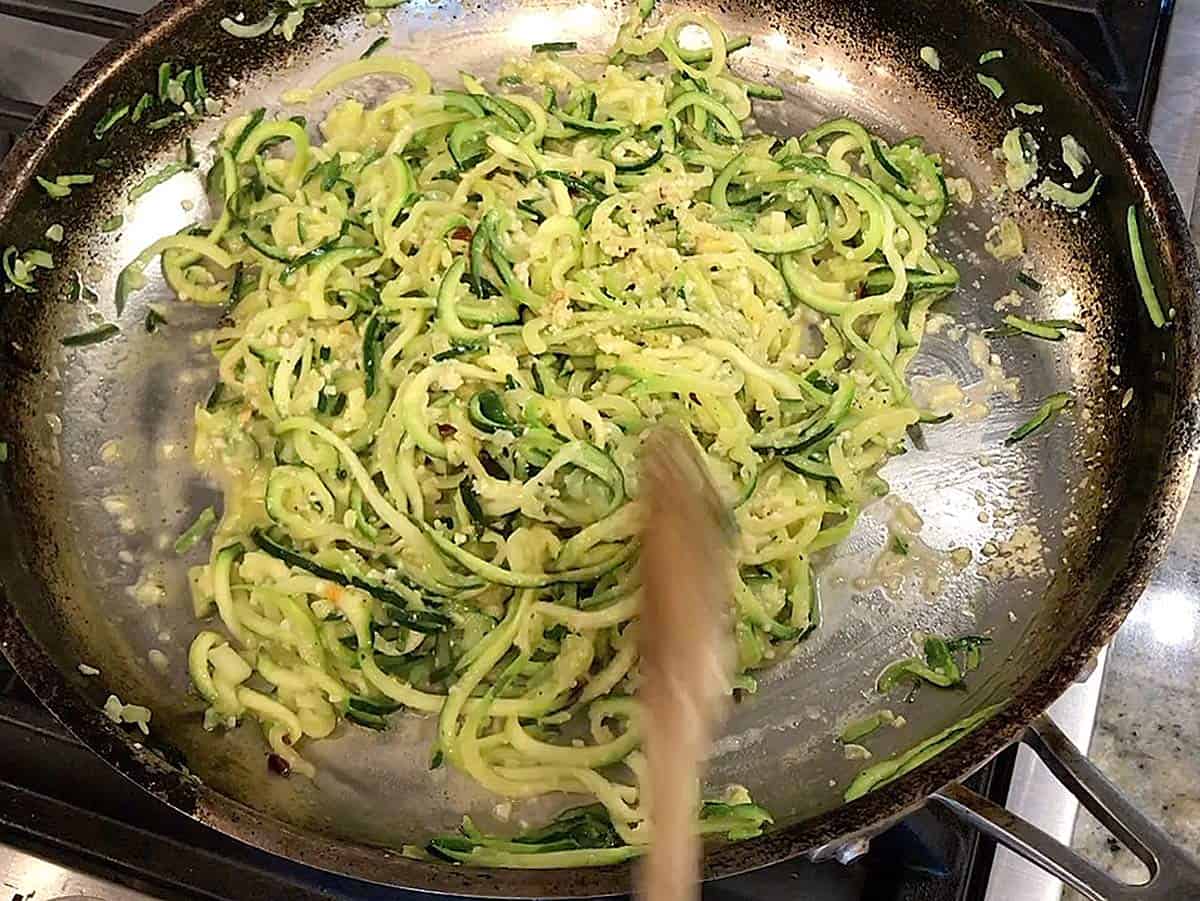 Zucchini noodles are ready in the skillet.
