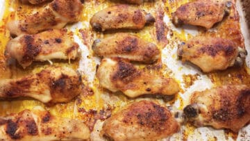 The wings are fully baked in the pan.