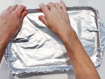 Covering the baking dish.