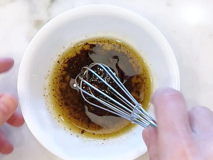 Mixing the marinade in a bowl.