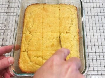 Slicing the bread in the pan.
