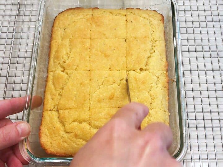 Slicing the bread in the pan.