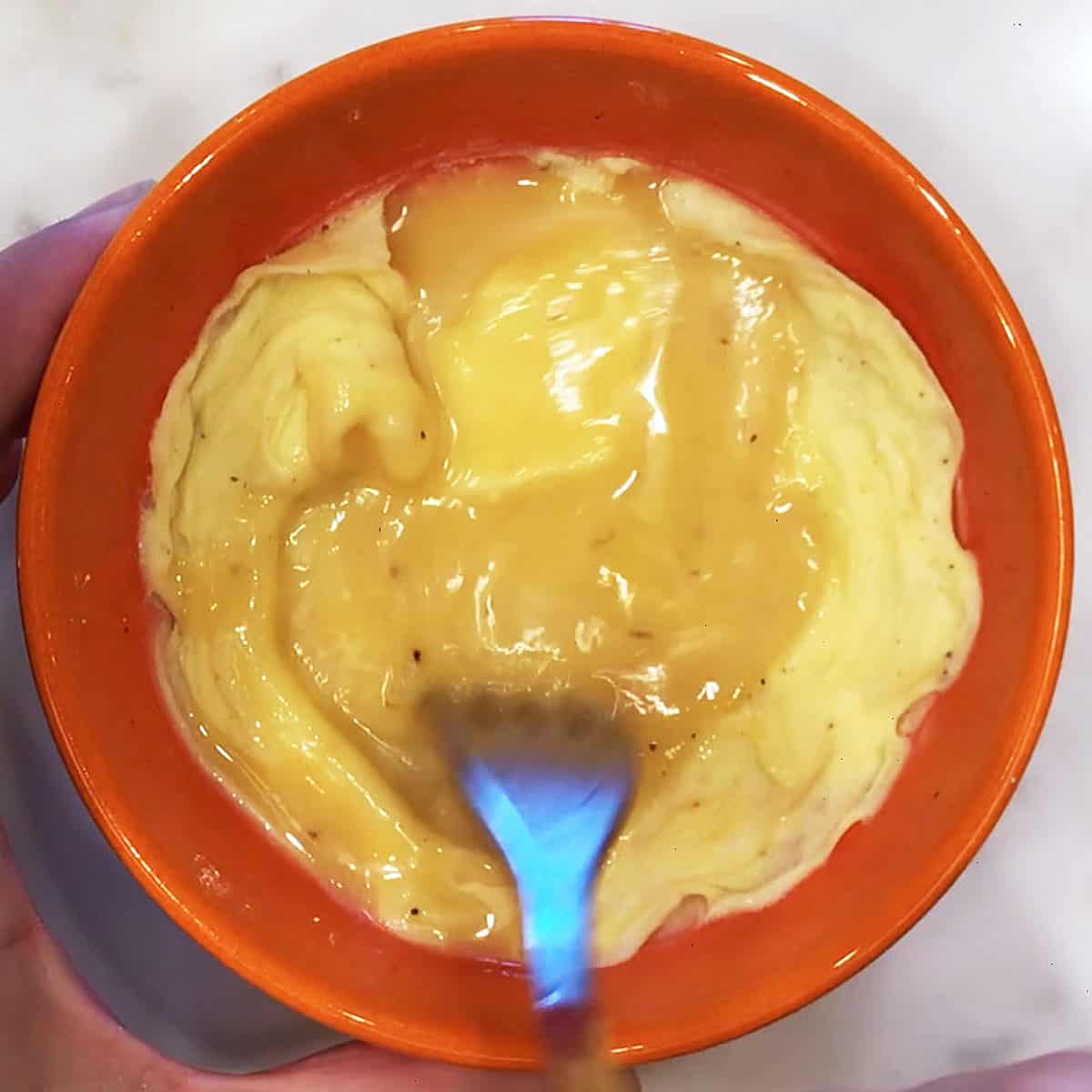 The microwave eggs are almost ready. Mixing them in the bowl.