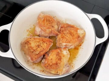 Browning the second side of the chicken.