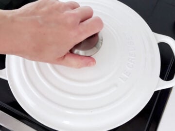 Covering the saucepan with a lid.