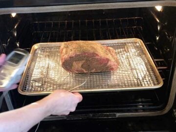 Placing the roast in the oven.