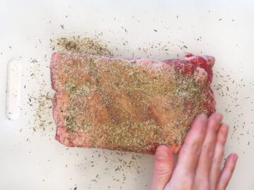 Seasoning ribeye roast.