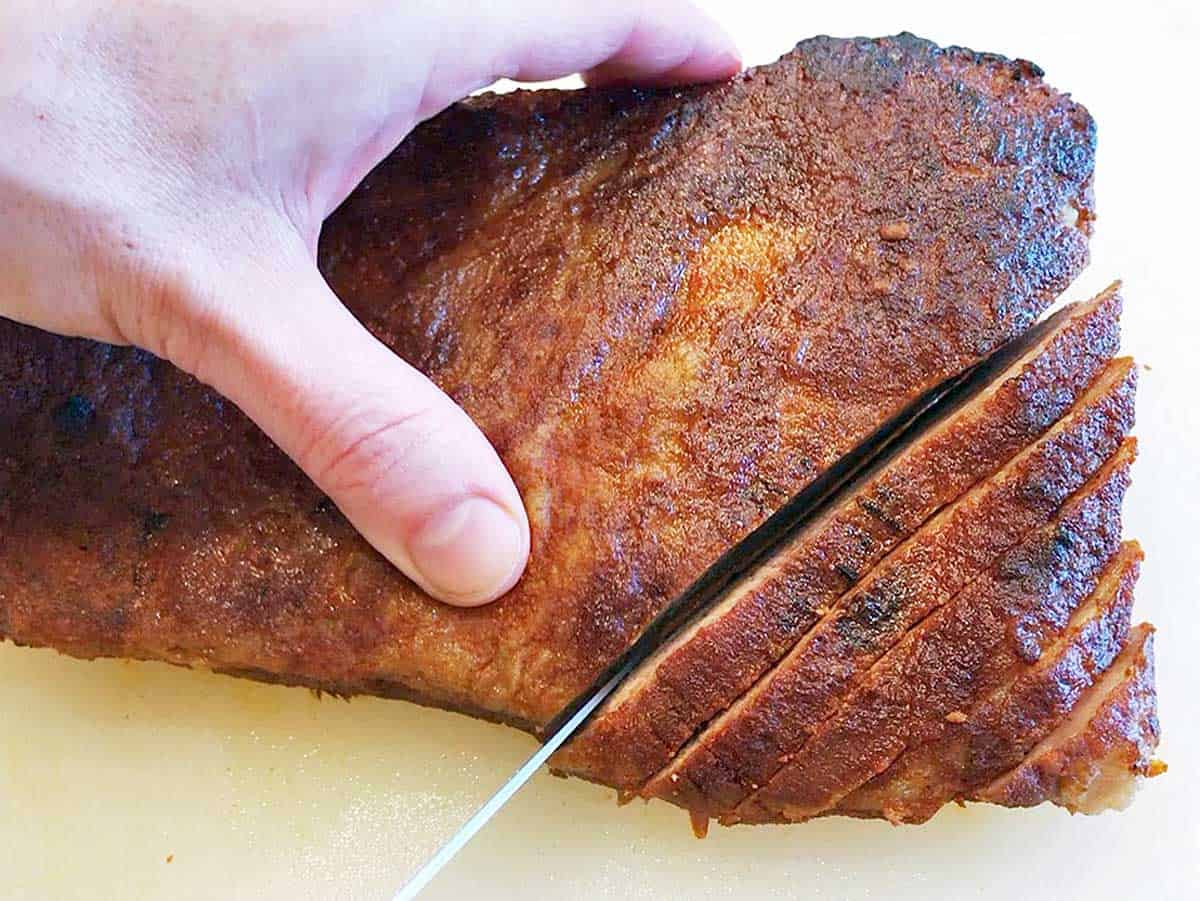 Slicing brisket with a sharp knife.
