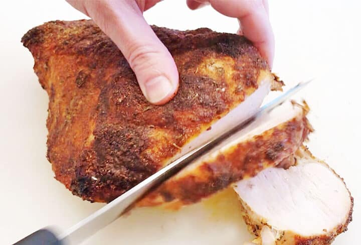 Slicing the turkey breast.