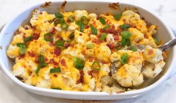 Serving cauliflower casserole.