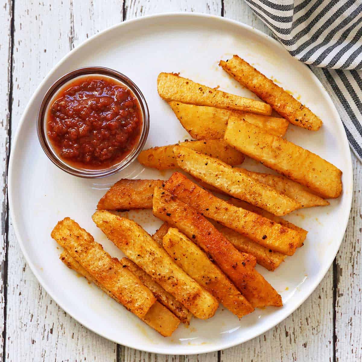 Jicama fries are served with salsa.