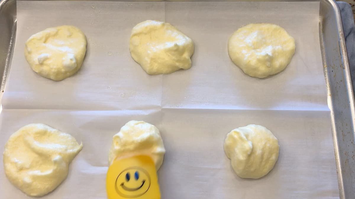 Gently flattening the mounds.