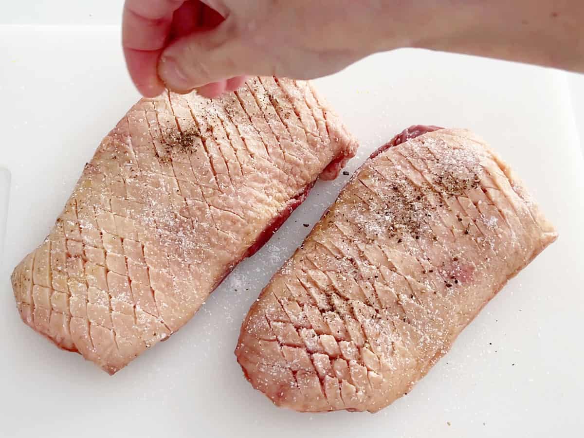 Seasoning the duck.