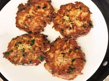Four tuna patties on a plate.
