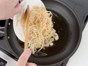 Add the pasta to the skillet.