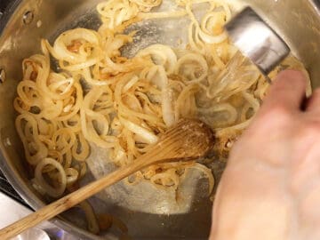 Adding wine to the skillet.