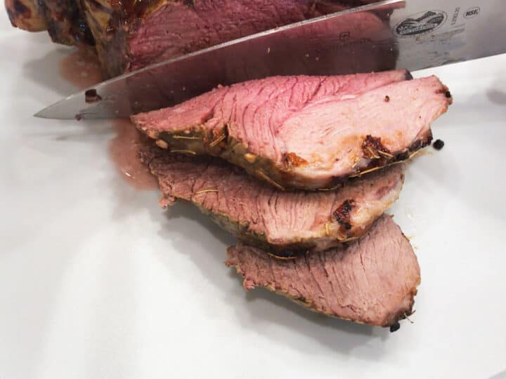 Slicing the leg of lamb.