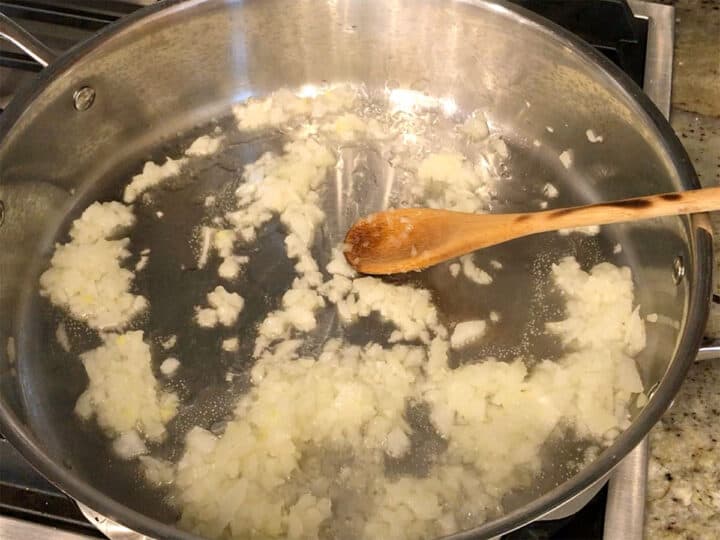 Cooking onions in a skillet.