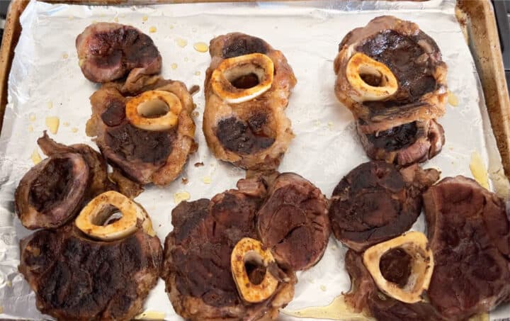 Cooked beef shanks on pan.